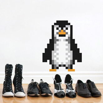 PUXXLE pinguin op de muur